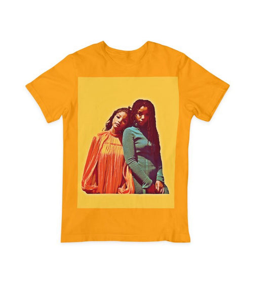 chloe x halle graphic tee in gold, the background of the design is yellow